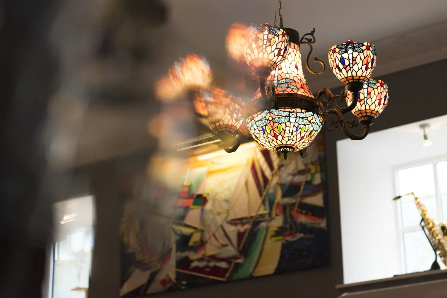 Stained-glass lights and artwork inside Bier Huis Grand Café